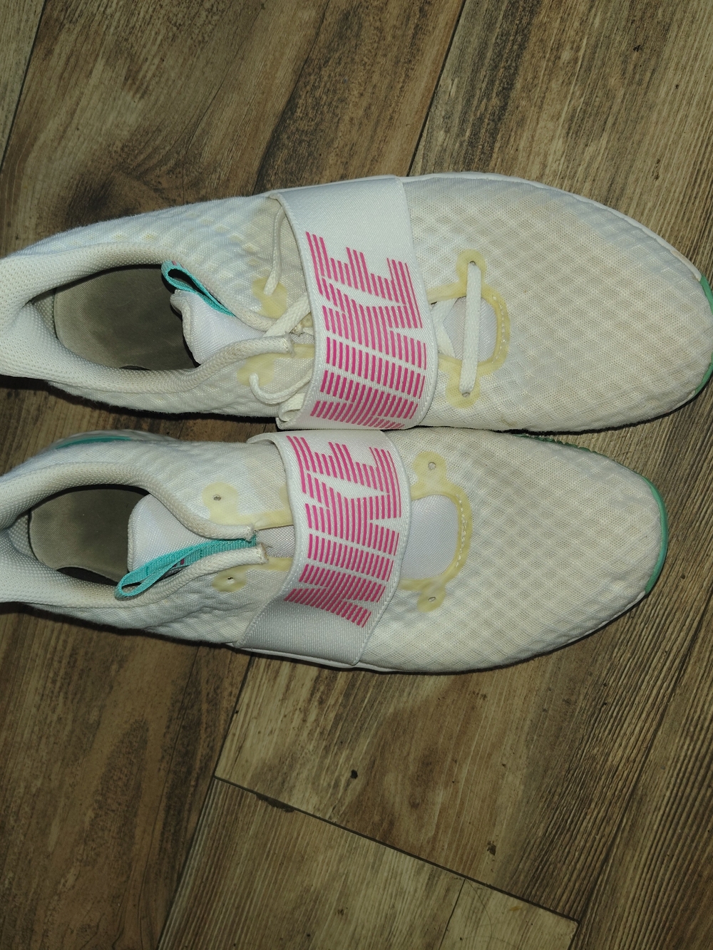 Nike White Sneakers with Pink Branding and Teal Accents